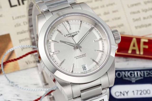 Af一浪琴Longines 康卡斯悦动自动机械系列机芯：自动机械表径：34Mm 表盘：蓝色太阳饰纹，绿色太阳饰纹，镀银夜光指针，镶嵌夜光珠时标 表镜材质：抗磨损