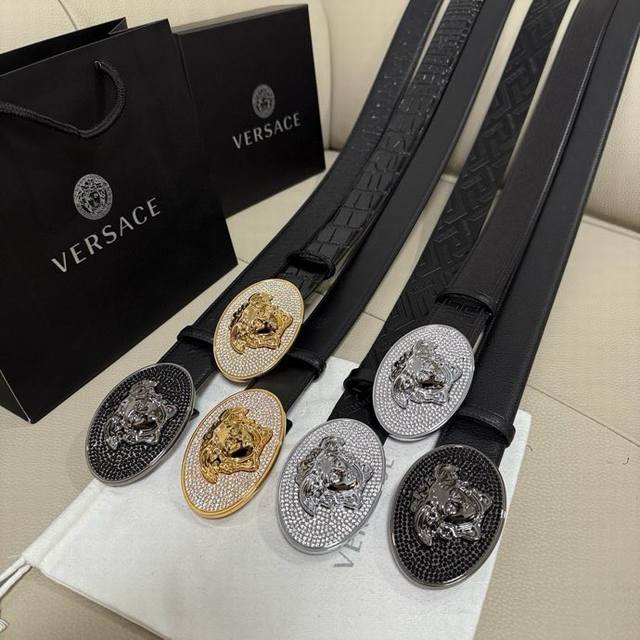 Versace, width 4.0Cm This cowhide belt is decorated with a crystal Medusa head a
