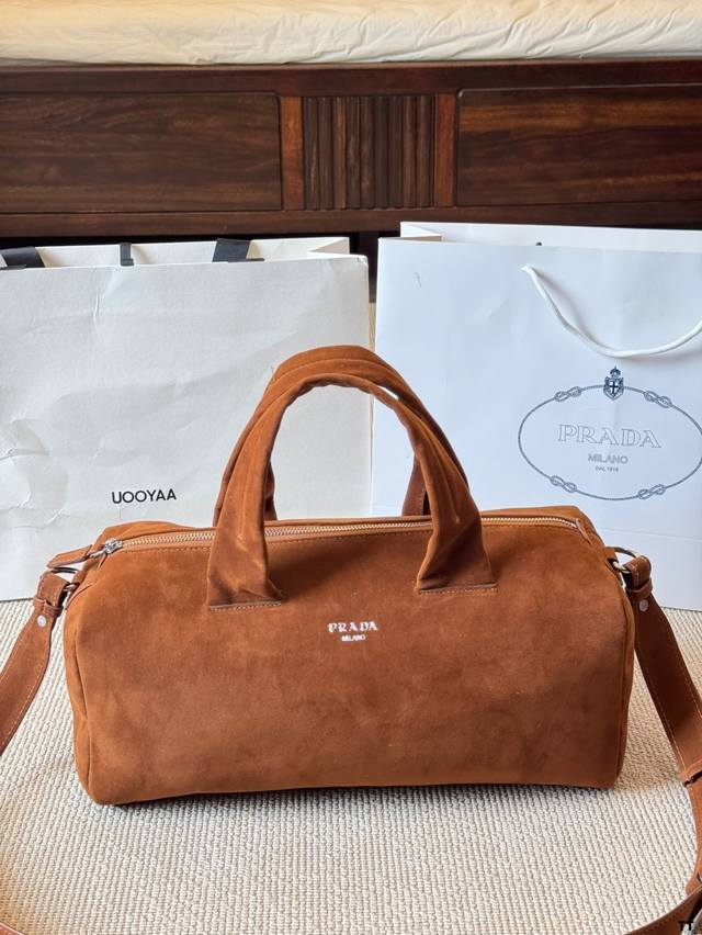Prada suede bag, factory-sourced vintage feel. From Prada's 25th spring/summer n