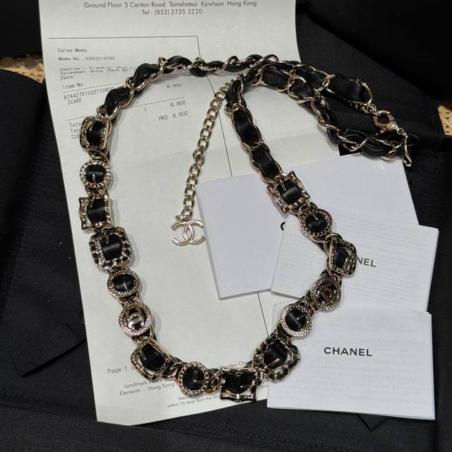 Chanel's new waist chain features classic Chanel black and gold, interwoven cha