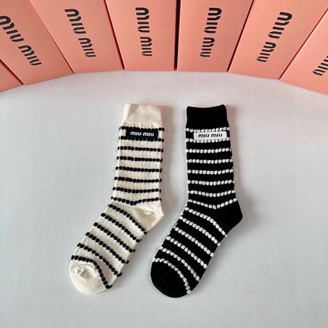 Special packaging for Miu Miu's new striped cashmere slouch socks! Two pairs per