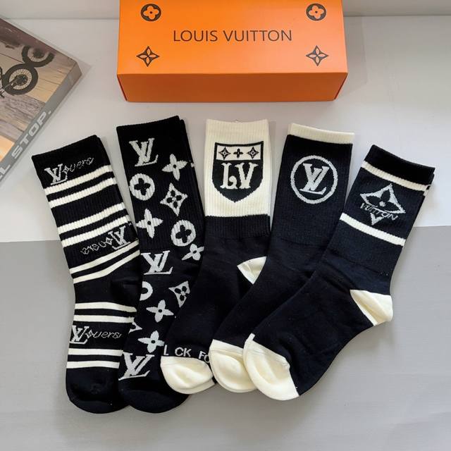 A box of 5 pairs of Louis Vuitton classic logo knee-high socks with packaging. A