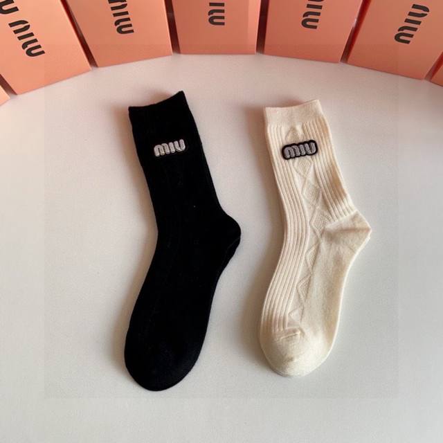 Special packaging for Miu Miu's new cashmere slouch socks! Two pairs per box, sa