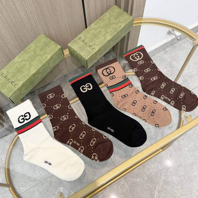 A box of five Gucci socks with packaging. A popular Gucci item, now available! T