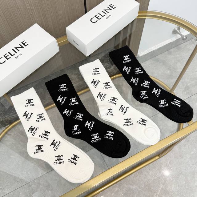 A box of four Celine high-quality, super popular straight-leg socks, featuring C