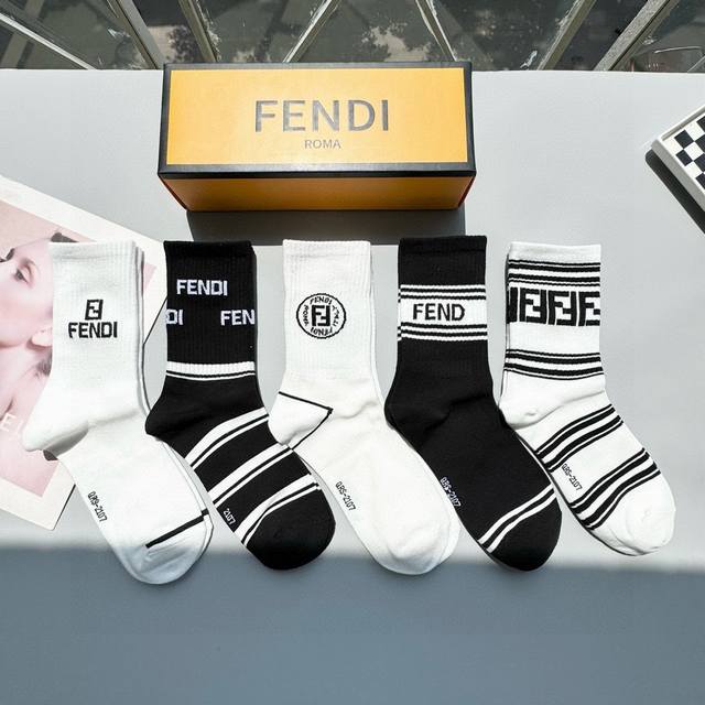 A box of five Fendi high socks with the classic double F logo, made of pure cott