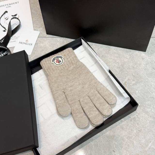 One box contains one pair of Moncler gloves. These are super popular online cele