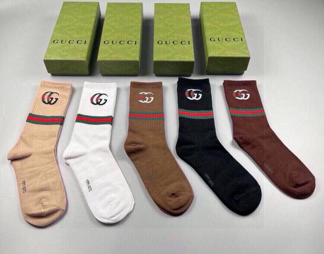 Gucci's newest knee-high socks, five pairs per box. The double G logo at the cu