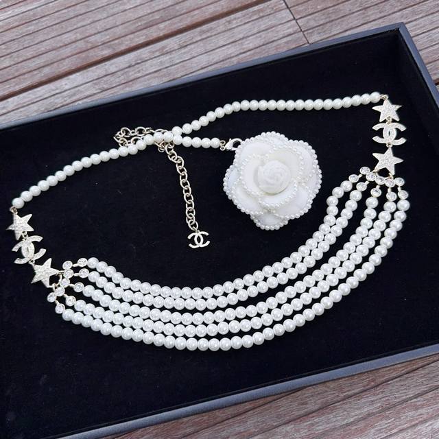 Chanel pearl and sterling copper diamond-encrusted waist chain. Length: One size